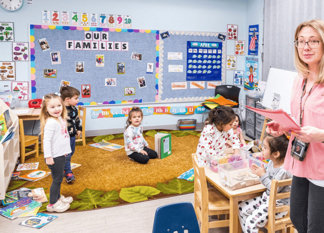 A classroom of kids and a teacher.